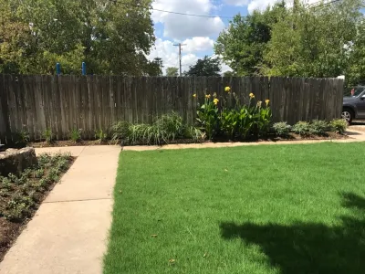Re-Landscaping Front of Building with Irrigation, New Flowerbeds, Boulder, & Sod — Landscape Design project by Sunrise Landscapes