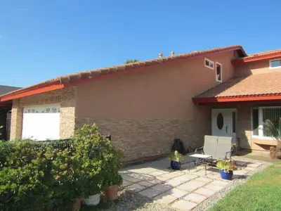 OUTDOOR PAINT / STONE CLADDING WALL COVERING by Precision Home Design & Remodeling