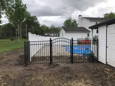 54-inch aluminum pool fencing with 6-foot white vinyl privacy fence by All American Fence Company