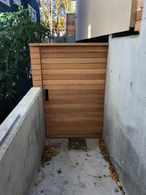 Contemporary Clear Cedar Fence with a Blend of Smooth and Textured Surfaces by Cool Cat Fence