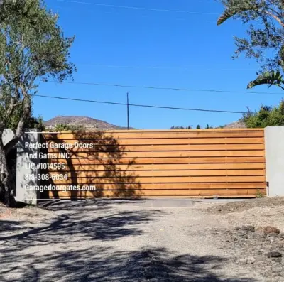 Crimson Western Cedar Entrance Gate — Fence Installation project by Perfect Garage Doors And Gates Inc.