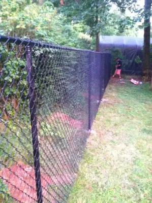 Newington Ponderosa PVC Privacy with Black Coated Chain Link by Hartford Fence Company