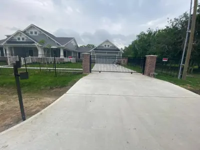 Driveway Gate in Aluminum Featuring "H" Centerpiece by My Garage And Gates