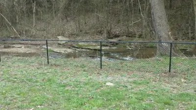 Vinyl-Coated Black Chain Link Fence by A-1 Fence & Deck Company