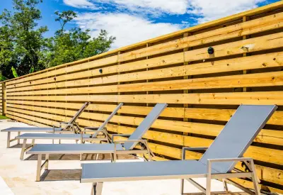 Bespoke Horizontal Wooden Fence by Freedom Fence & Aluminum