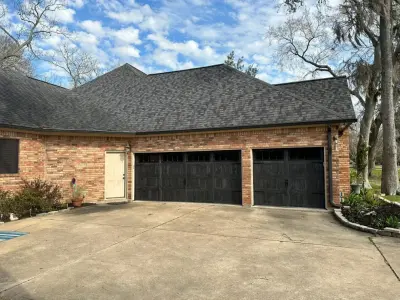 Carbon Oak Wood Accent Garage Door with Stamped Carriage Design — Fence Installation project by My Garage And Gates