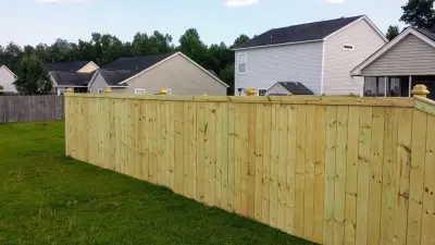 Pond View Wood Fence with Trim Rail — Fence Installation project by Collins Construction