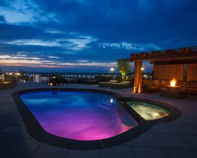 Resort Style Custom Pools with Modern Design by Beechwood Landscape Architecture And Construction