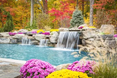 Freeform swimming pool with a raised spa and grotto, Mahwah, NJ by Thomas Flint Landscape Design & Development
