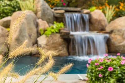 Natural pool with fieldstone waterfall and waterslide, Ridgewood NJ by Thomas Flint Landscape Design & Development