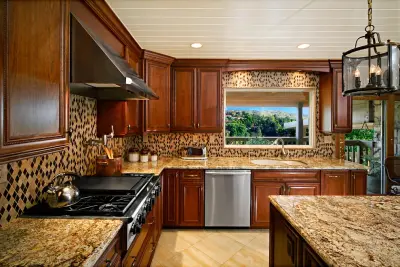 La Habra Heights Kitchen with Stained Cherry Wood Island — Kitchen Remodeling project by The Kitchen Design Center