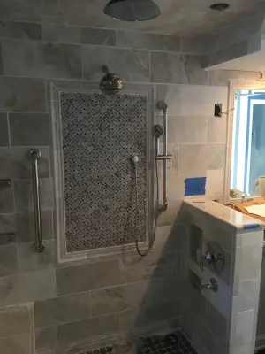 Luxury bathroom featuring heated flooring by Spencer Remodeling