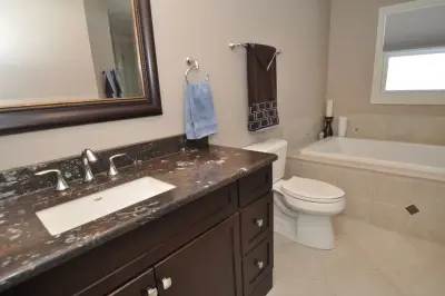 Menomonee Falls Bedroom Transformed into a Master Bathroom Retreat by Advantage Design + Remodel