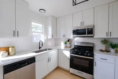 Contemporary White Kitchen — Kitchen Remodeling project by LFM Construction & Remodeling