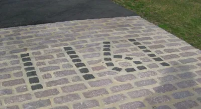 Cobblestone Driveway Entrance by Woodward Landscape Supply