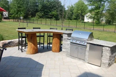 Patio with Unique Cooking and Eating Area — Landscape Design project by Woodward Landscape Supply