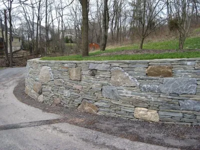 Colonial Gray Stone Retaining Wall — Landscape Design project by Woodward Landscape Supply