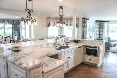 Modern French Kitchen - Opulence by the River — Custom Home Builders project by Baine Contracting, Inc.