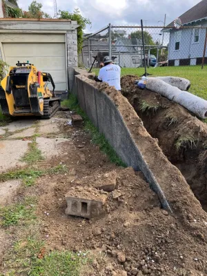 Retaining Wall Repair with Drain Tile / French Drain Installation — Landscape Construction project by A+ Equipment Services And Excavation in Toledo