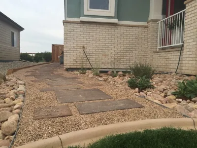 Windsor Lake landscape, paver path, and pond installation by All Terrain Landscaping