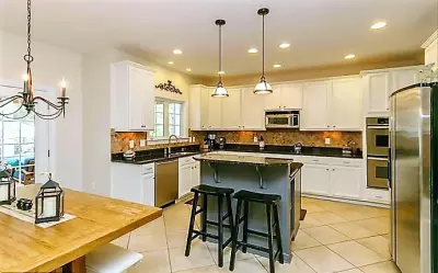 Elevated Breakfast Bar Kitchen | Annapolis, MD — Custom Home Builders project by Evergreen Building Group, LLC.