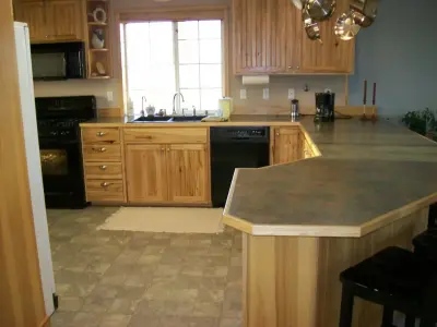 Country-style Kitchen (H 55) — Custom Home Builders project by Trilogy Construction, Inc.