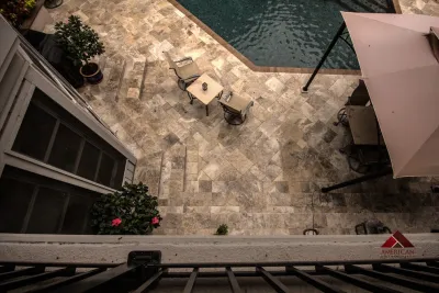 Travertine Pool Deck — Landscape Construction project by American Paving Design