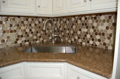 Tile Backsplash for Laundry Room Storage — Kitchen Remodeling project by Renovations, Inc.