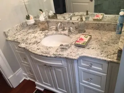 Ginger Quartz and White Ice Granite Countertop — Kitchen Remodeling project by North Lion Stone