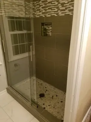 Tailored Gray Shower Enclosure — Kitchen Remodeling project by Paramount Tile Design