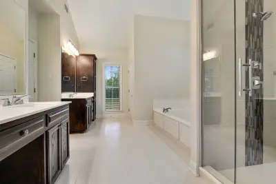 White Bathroom on Highland Road — Kitchen Remodeling project by Spencer's Contracting LLC