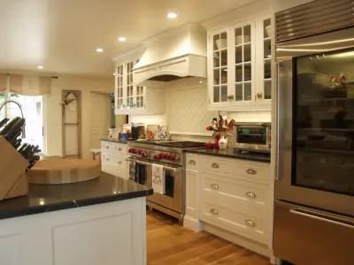 White Painted Kitchen with Wood Hood Insert — Kitchen Remodeling project by Featherstone Cabinetry & Design