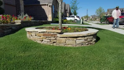Drystack Retaining Wall for Flower Beds — Landscape Construction project by Be Green Texas Lawn Care