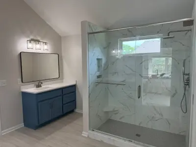 Radiant and Stylish Bathroom Renovation — Home Renovation & Remodeling Services project by Reliance Construction Group