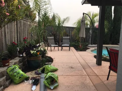 Creating shady seating areas around an existing pool by Bluestar Landscape Designers