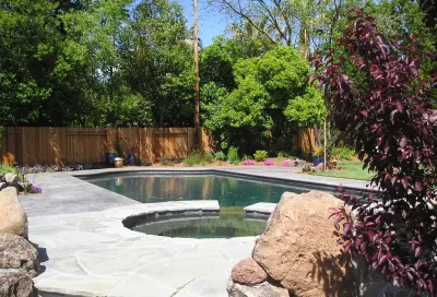 Pool with spa and waterfall — Landscape Design project by Bluestar Landscape Designers in Sacramento
