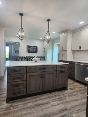Timeless Dual-Hued Kitchen by Miracle Contracting Inc.
