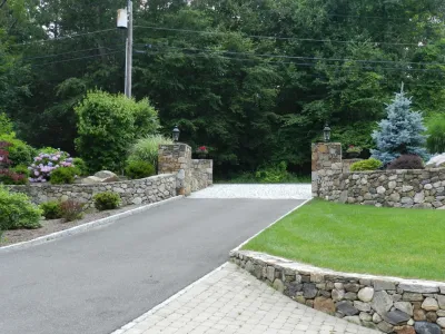 Driveway Entry Pillars, Stone Wall and Landscaping — Landscape Construction project by Bolton Landscape Design & Masonry Inc in Wilton