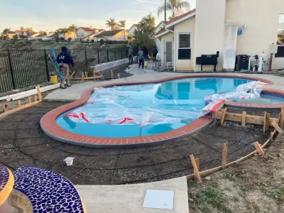 Pool Deck in Concrete — Home Renovation & Remodeling Services project by EMC General Contractors