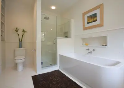 Modern White Restroom — Home Renovation & Remodeling Services project by Irwin Brothers Remodeling