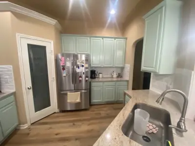 Custer Cabinet Refinish, Backsplash Installation, Granite Countertops, and Flooring by Stillwater Building & Remodeling