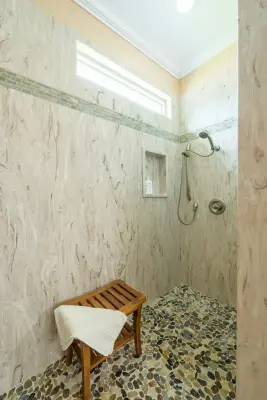 Bespoke Bathroom Renovation Featuring Corian® Walk-in Shower — Home Renovation & Remodeling Services project by First Choice Home Remodeling