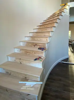 Tailored Curved Staircase — Home Renovation & Remodeling Services project by BradWay Construction And Restoration, LLC
