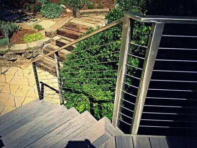 Tailored Deck Construction with Stainless Steel Railings — Home Renovation & Remodeling Services project by Icon Construction & Remodeling