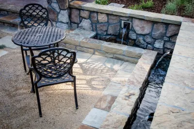 Mediterranean Sunken Patio in Littleton by C&H Landscaping