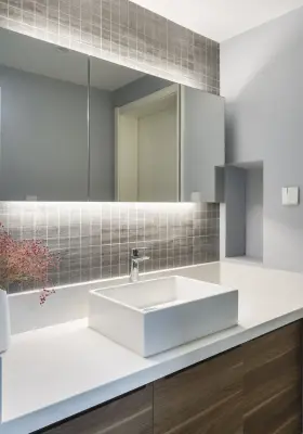 Ashen Restrooms by Kitchen Master Design & Remodeling LLC