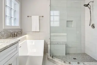 Elevated Point Primary Bathroom by Badin Lake Builders