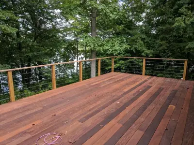 Ipe decking with stainless steel cable railings — Home Renovation & Remodeling Services project by A.M.Carter Construction Inc