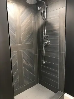 Shower with barn door design by Mel's Carpet Outlet