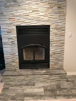Layered stone fireplace — Carpet Installation project by Mel's Carpet Outlet
